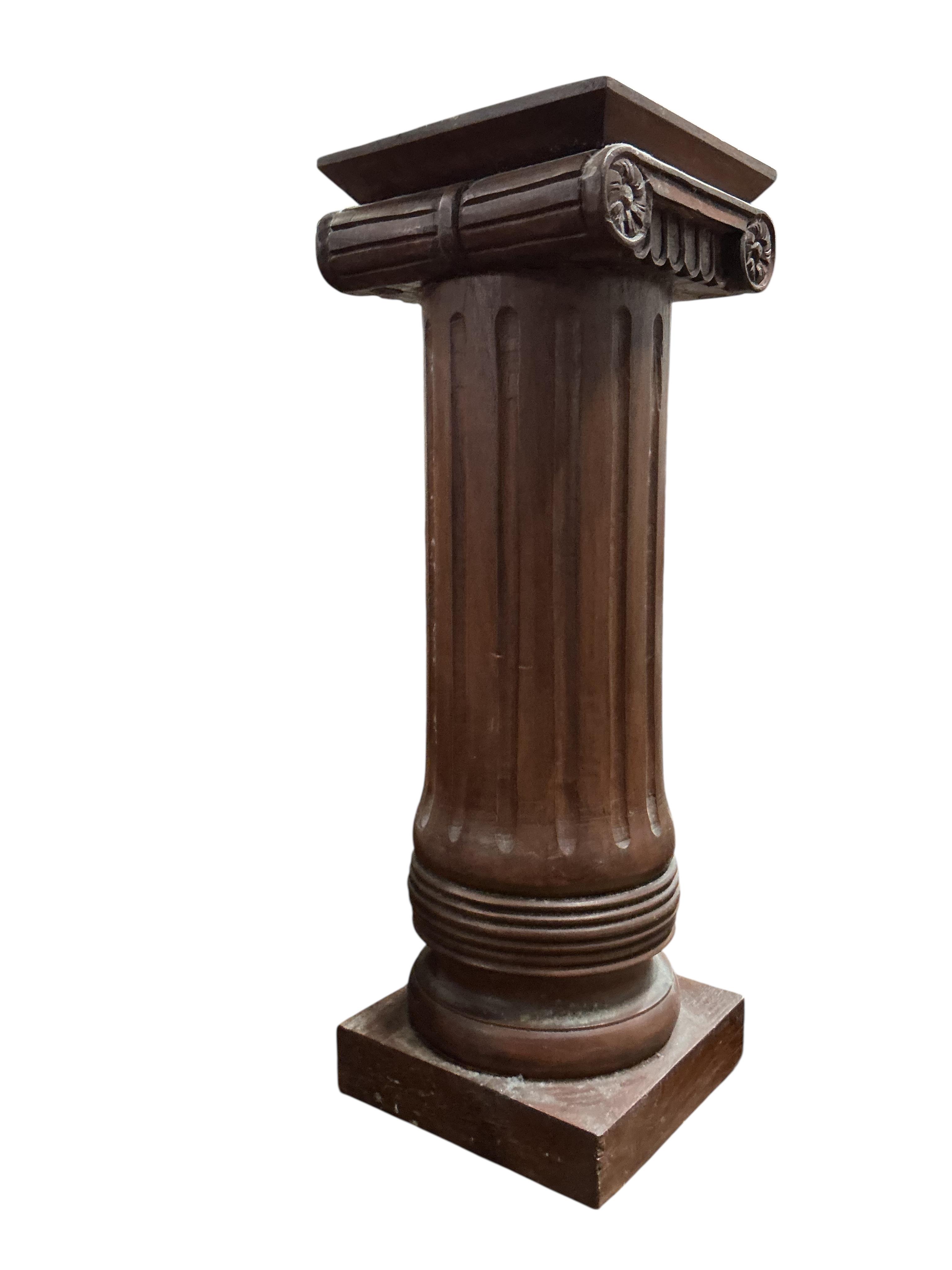 A reproduction mahogany ionic column pedestal, height 62cm